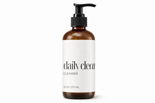 Brown bottle with pump and white label on a white background
